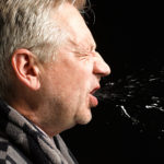 Man with flu coughing and sneezing